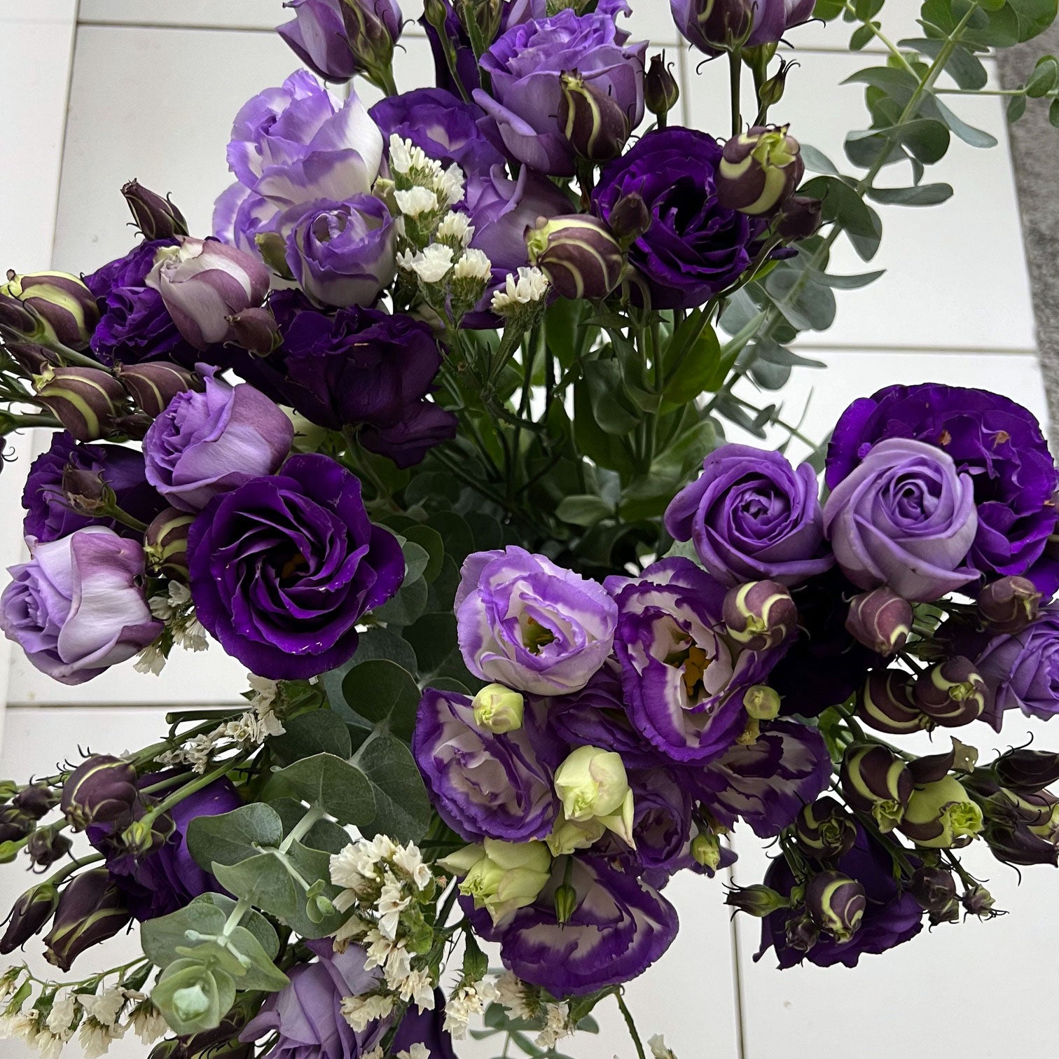 purple flower arrangement with silver-leaved mountain gum